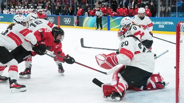 “Poulin’s Heroic Performance Leads Canada to Olympic Hockey Final”